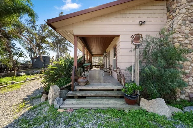 a view of a house with patio and garden