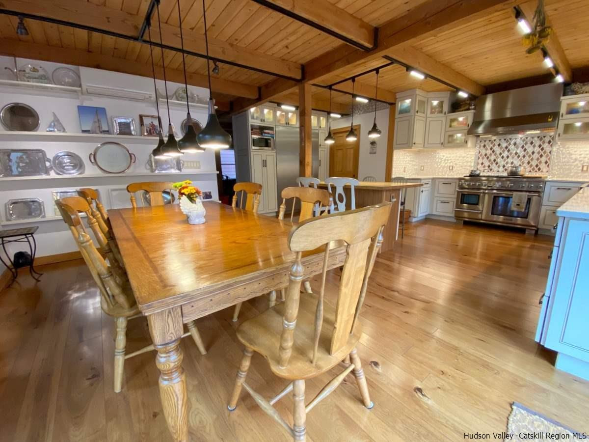 56 Ridge Road Shokan, NY 12481 - Photo 11 of 34 a view of a dining room with furniture and a kitchen view