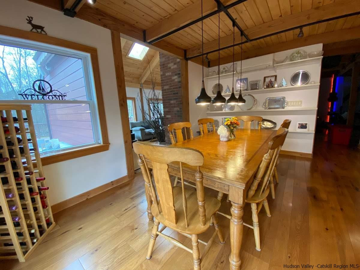 56 Ridge Road Shokan, NY 12481 - Photo 12 of 34 a view of a dining room with furniture and wooden floor