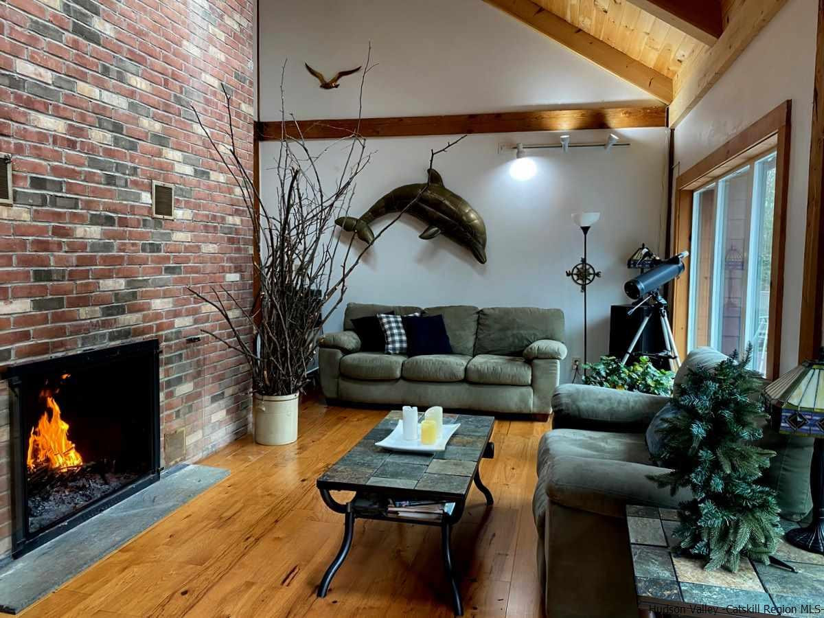 56 Ridge Road Shokan, NY 12481 - Photo 13 of 34 a living room with furniture and a fireplace