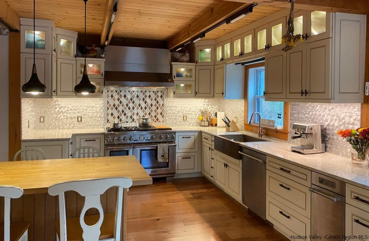 56 Ridge Road Shokan, NY 12481 - Photo 7 of 34 a kitchen with stainless steel appliances granite countertop a sink a stove and a wooden cabinets
