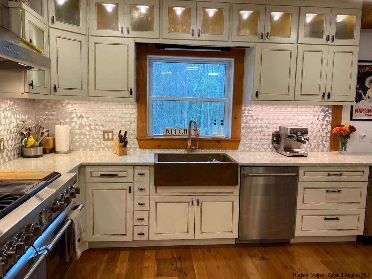 56 Ridge Road Shokan, NY 12481 - Photo 9 of 34 a kitchen with stainless steel appliances granite countertop a stove a sink and a microwave