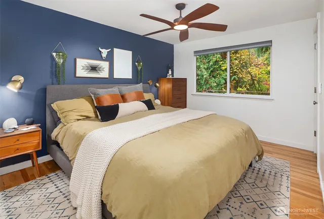 a bedroom with bed and window