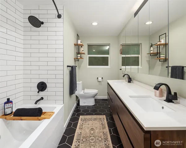 a bathroom with a sink and a large mirror