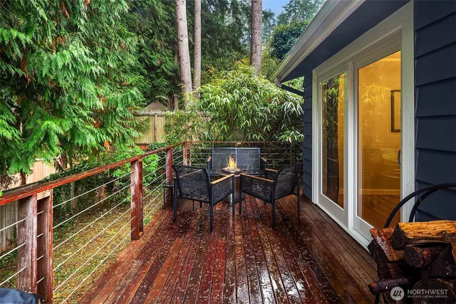 a view of balcony with chairs and wooden floor