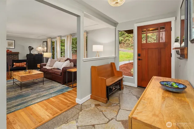 a living room with patio furniture and a table