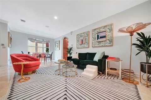 a living room with furniture and a couch