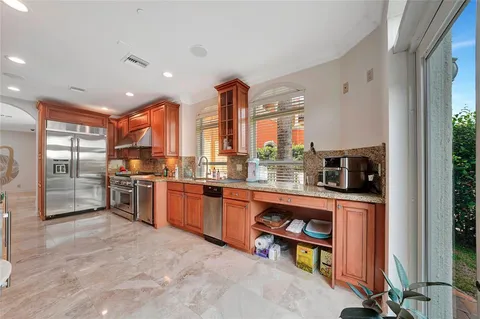 a spacious bedroom with a bed and wooden floor