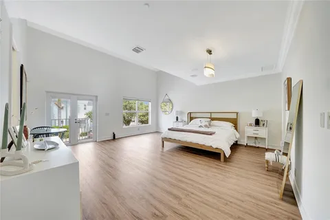 a large bathroom with a granite countertop tub a double vanity sink a mirror and a shower