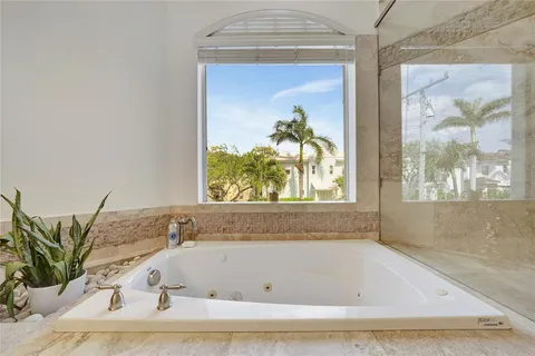a view of room with window and wooden floor