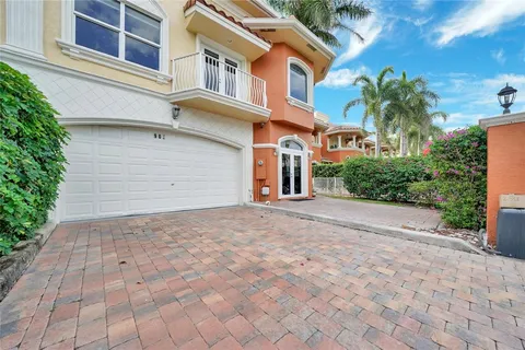 a view of a white apartments with large windows