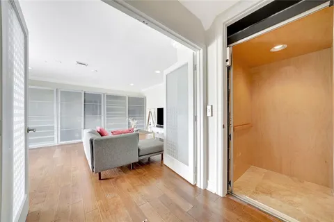 a view of a balcony with wooden floor and fence