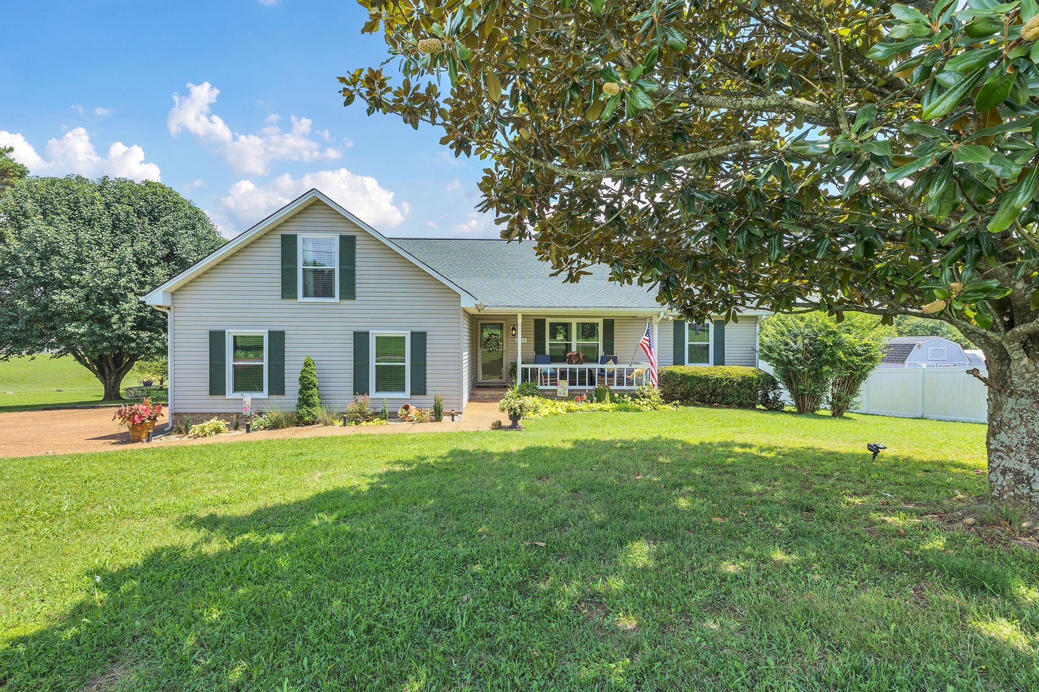 2113 Spring Lake Drive Spring Hill, TN 37174 - Photo 1 of 27 a front view of a house with a garden