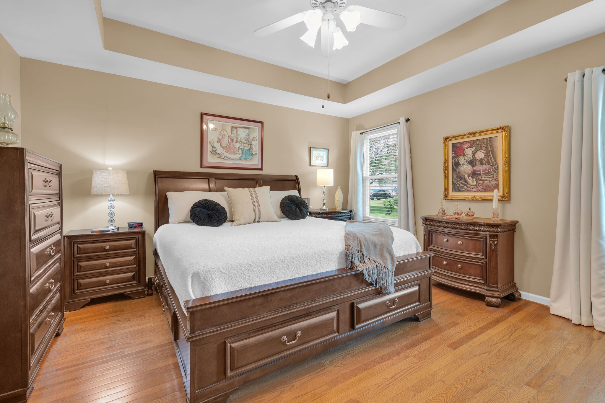 2113 Spring Lake Drive Spring Hill, TN 37174 - Photo 14 of 27 a bedroom with a bed and a chandelier