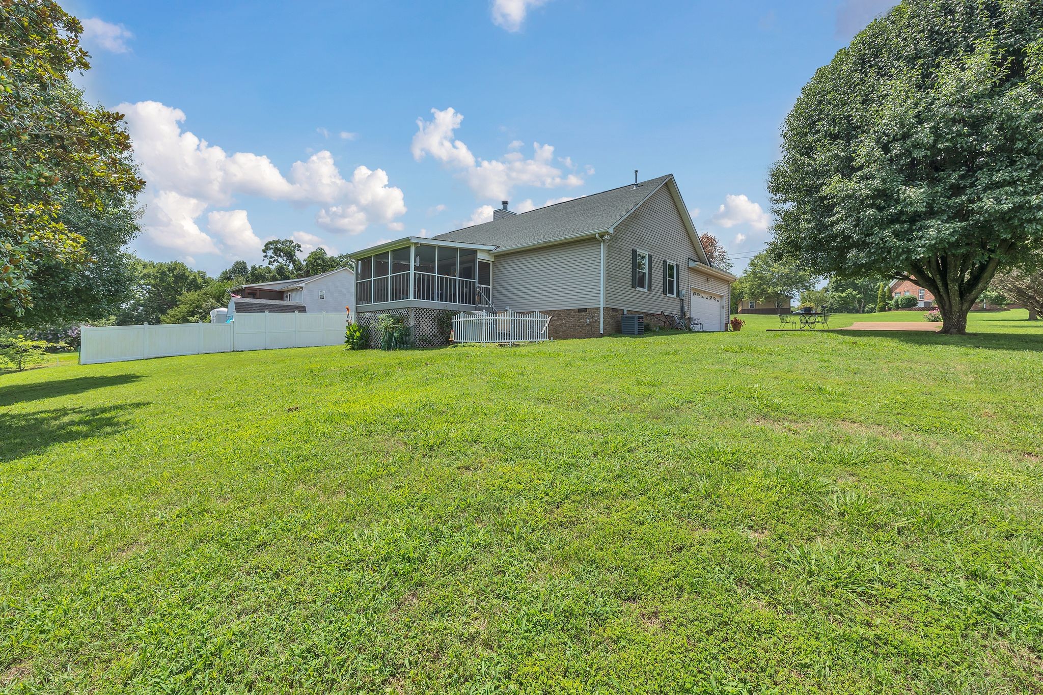 2113 Spring Lake Drive Spring Hill, TN 37174 - Photo 23 of 27 a view of a house with a yard and large trees