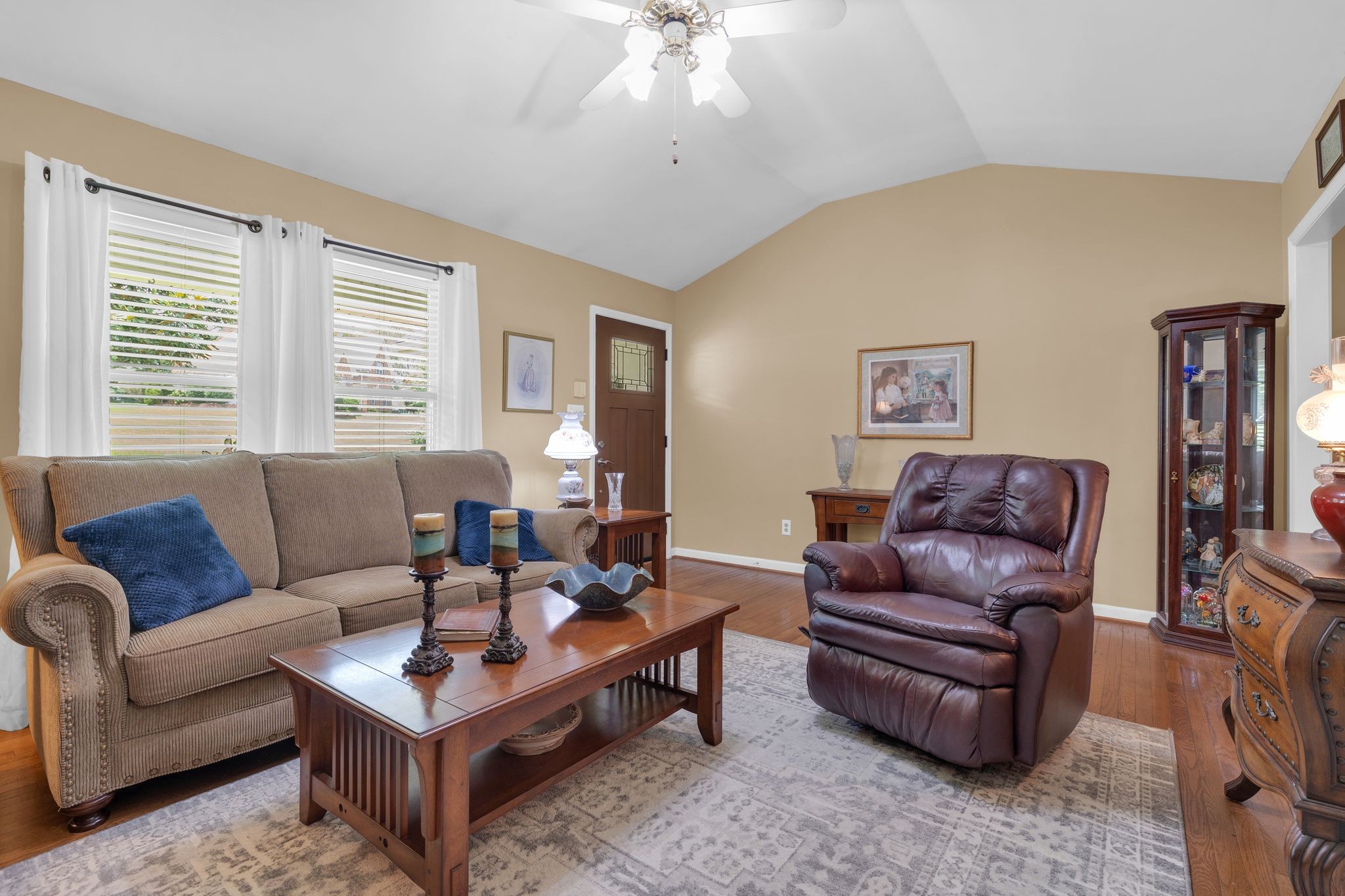 2113 Spring Lake Drive Spring Hill, TN 37174 - Photo 8 of 27 a living room with furniture a flat screen tv and a window