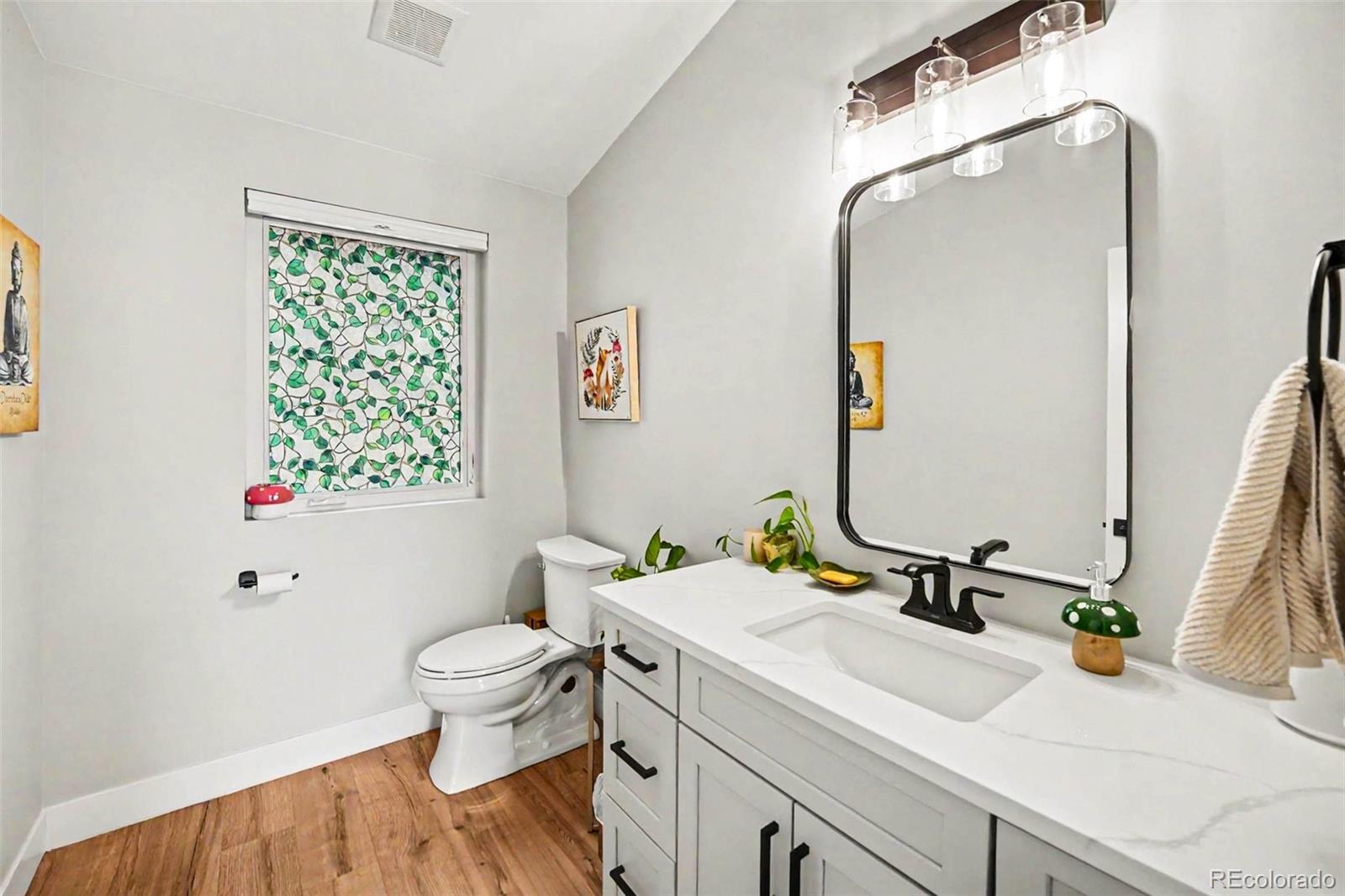 7231 Timber Trail Road Evergreen, CO 80439 - Photo 21 of 35 a bathroom with a sink vanity mirror and toilet
