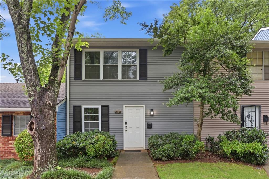 413 Promenade Court Marietta, GA 30064 - Photo 1 of 28 front view of house with a yard