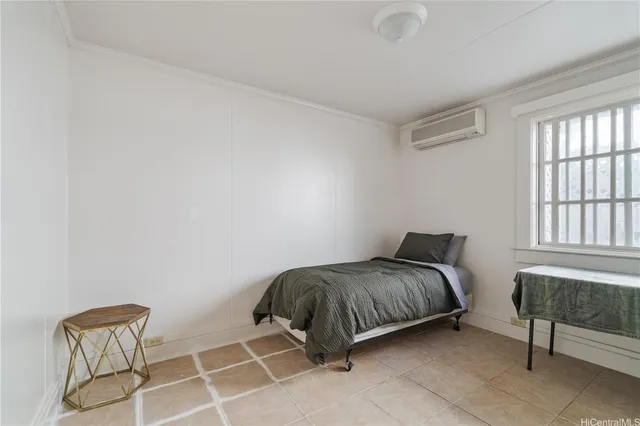 a room with a bed and a chair