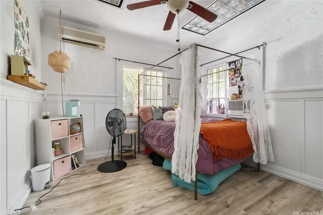 a bedroom with furniture and a chandelier