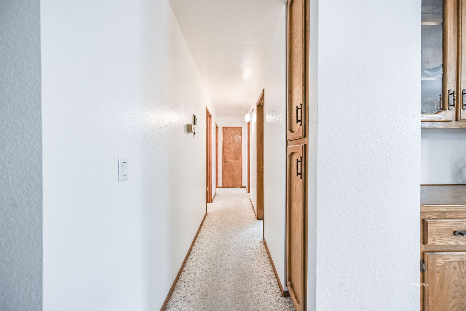 412 Lorene Court Ridgecrest, CA 93555 - Photo 15 of 31 a view of a hallway with a white walls