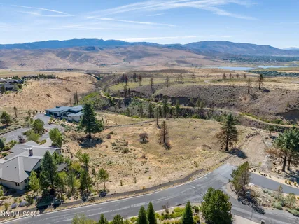 a view of a town with mountains in the background