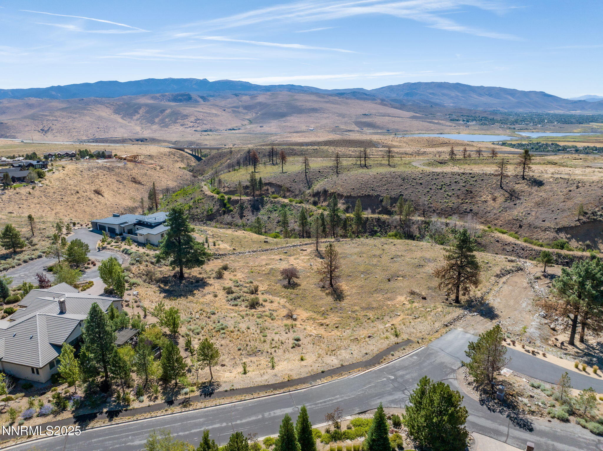 203 South Argyle Court Reno, NV 89511 - Photo 22 of 30 a view of a lake with mountains in the background