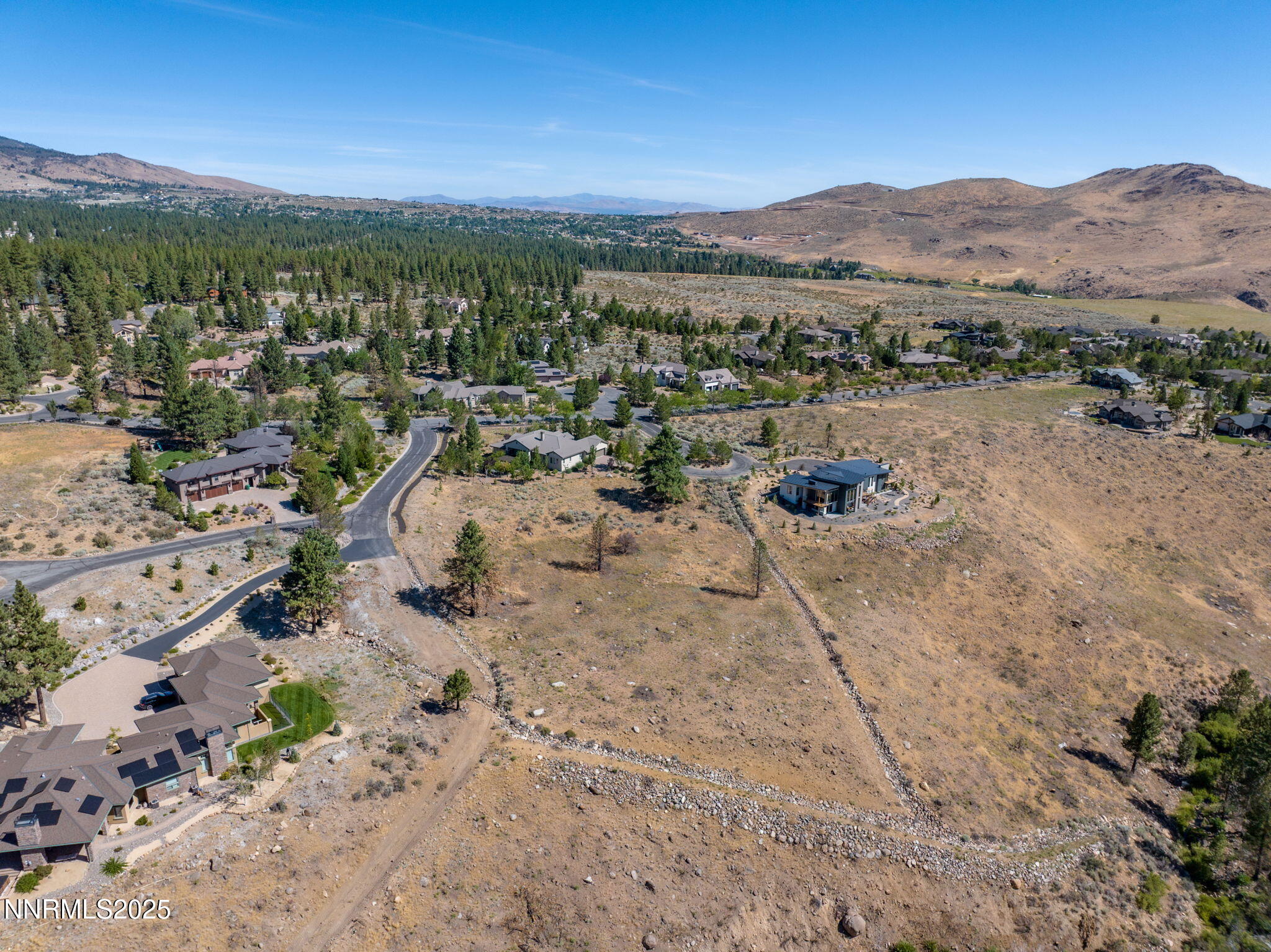 203 South Argyle Court Reno, NV 89511 - Photo 23 of 30 a view of a town with mountains in the background