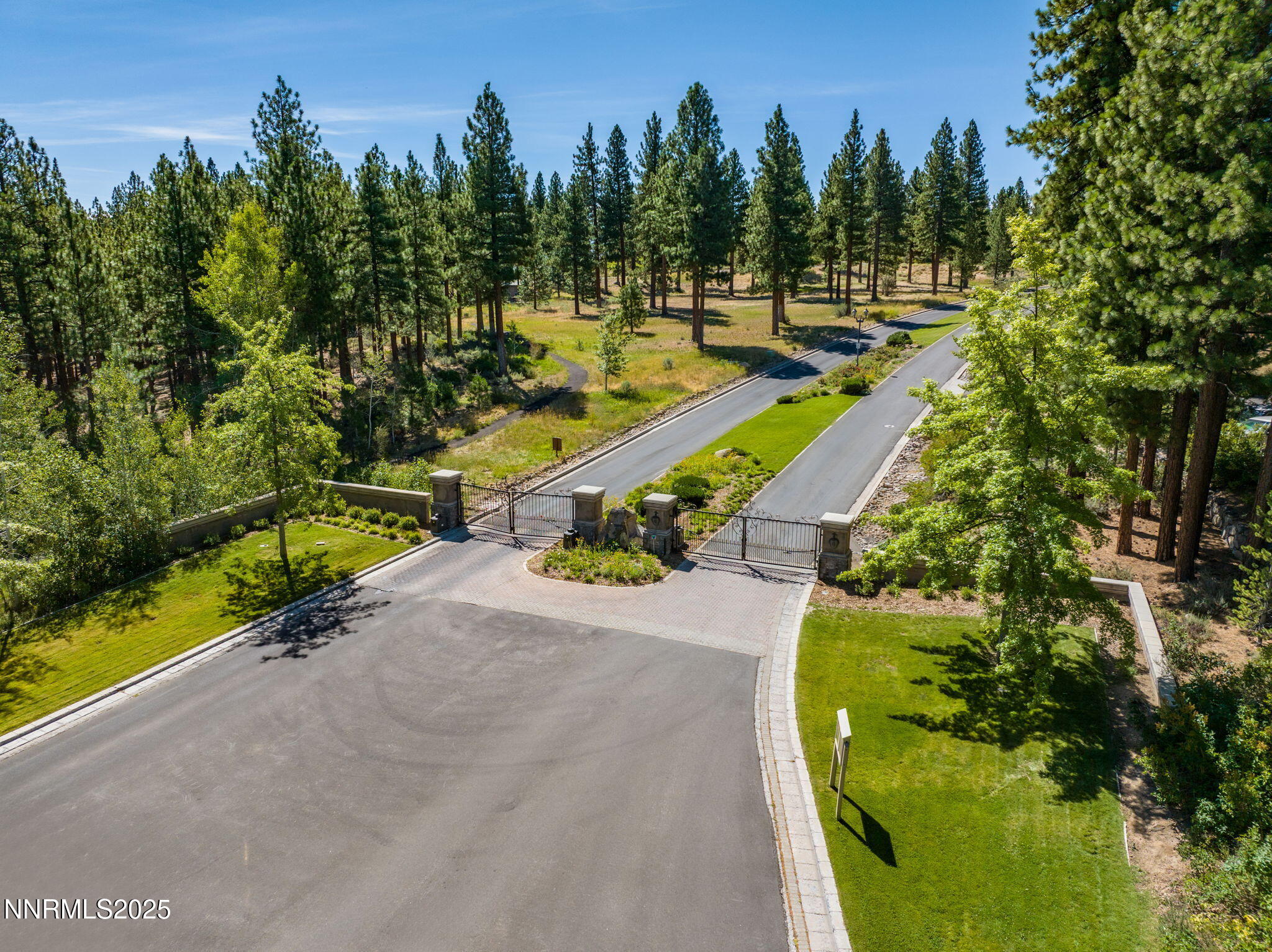 203 South Argyle Court Reno, NV 89511 - Photo 8 of 30 a view of a swimming pool with a yard and trees in the background