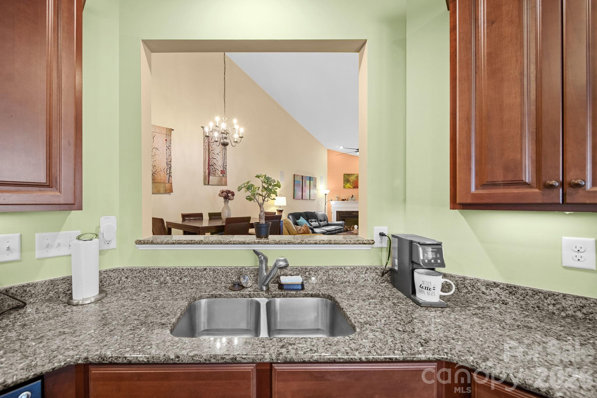 115 Inlet Point Drive Fort Mill, SC 29708 - Photo 13 of 48 a kitchen with granite countertop a sink and a granite counter tops