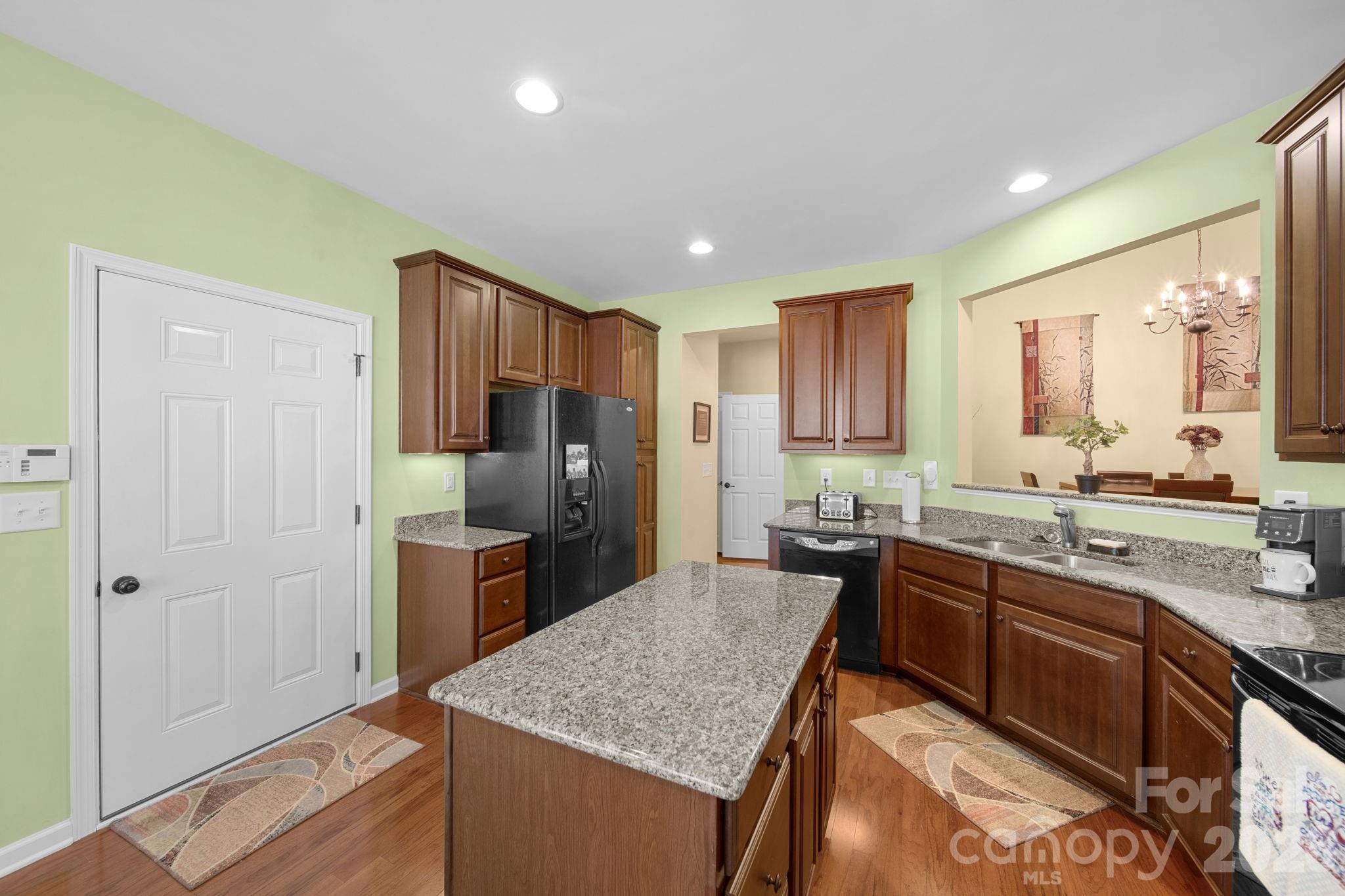 115 Inlet Point Drive Fort Mill, SC 29708 - Photo 14 of 48 a kitchen with stainless steel appliances granite countertop a sink stove and refrigerator