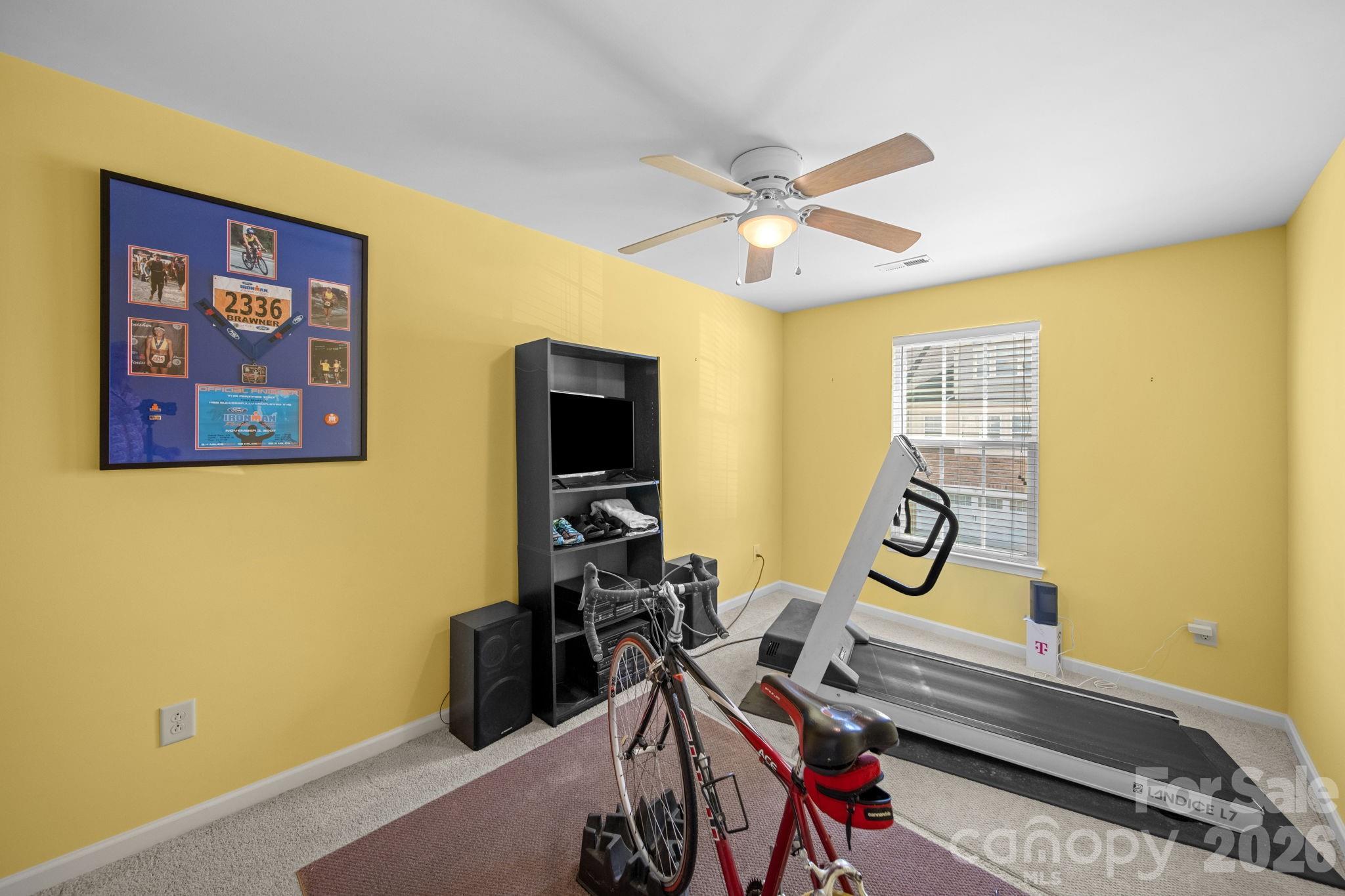 115 Inlet Point Drive Fort Mill, SC 29708 - Photo 23 of 48 a room with musical instruments and a ceiling fan