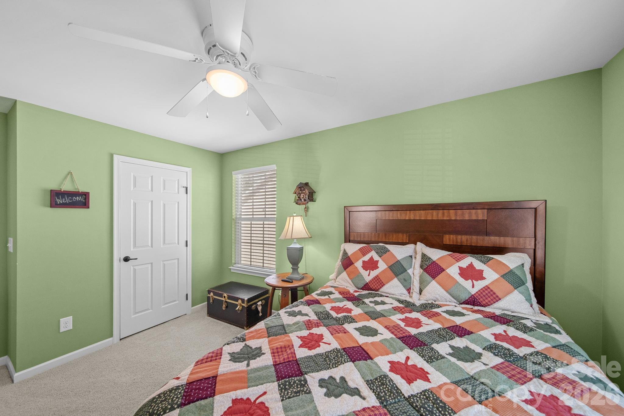115 Inlet Point Drive Fort Mill, SC 29708 - Photo 25 of 48 a bedroom with a bed and a painting on the wall