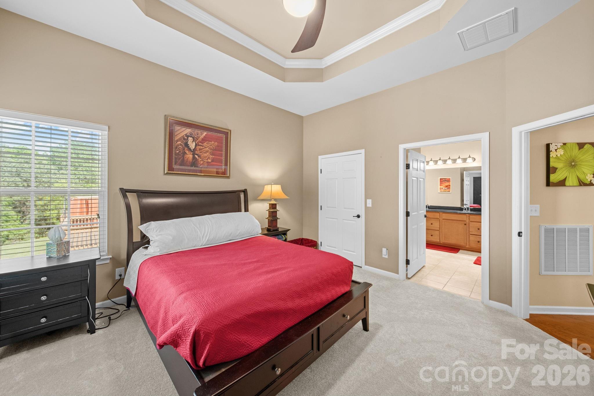115 Inlet Point Drive Fort Mill, SC 29708 - Photo 32 of 48 a bedroom with a large bed and a window