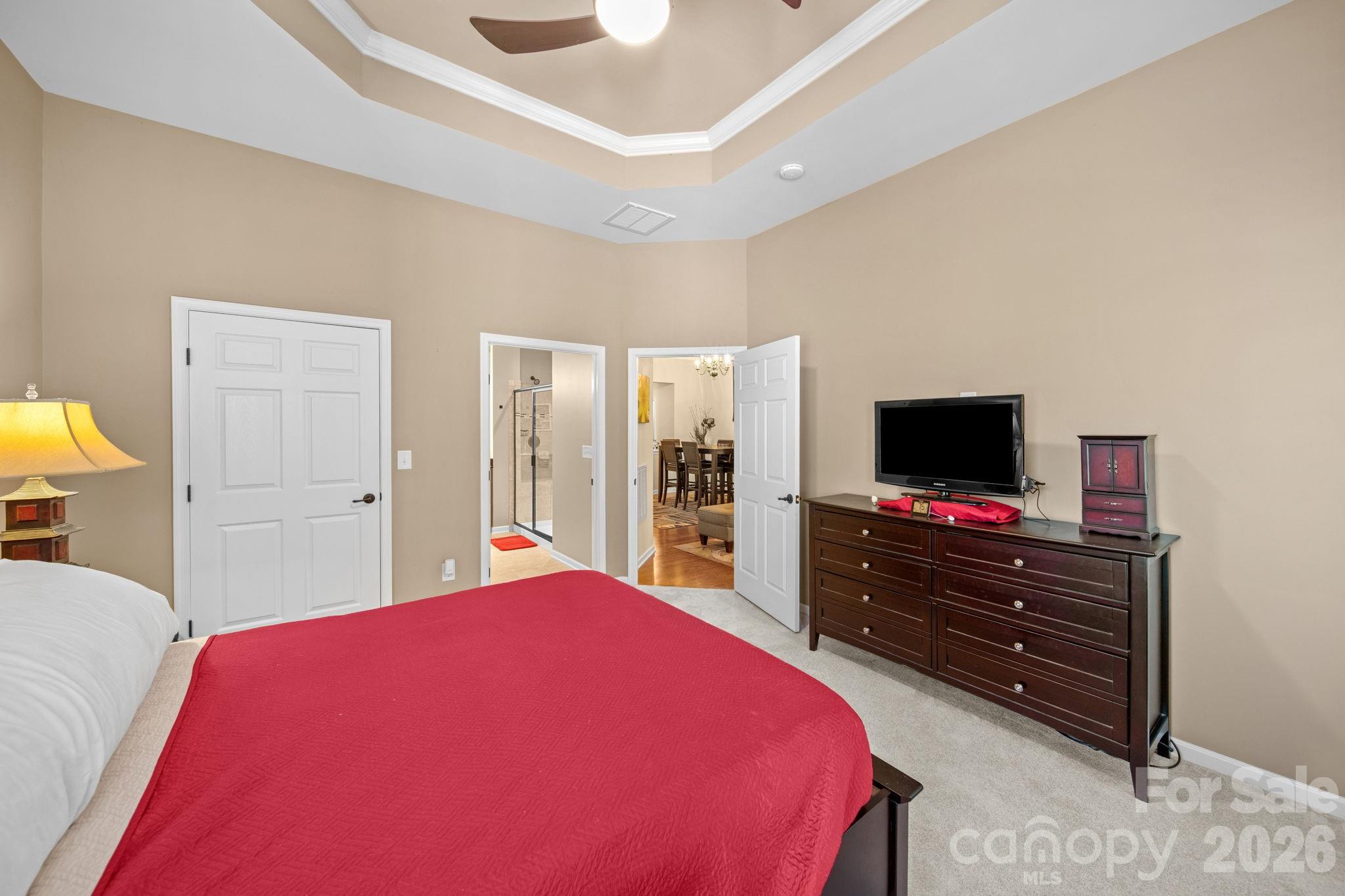 115 Inlet Point Drive Fort Mill, SC 29708 - Photo 33 of 48 a living room with a bed and flat screen tv