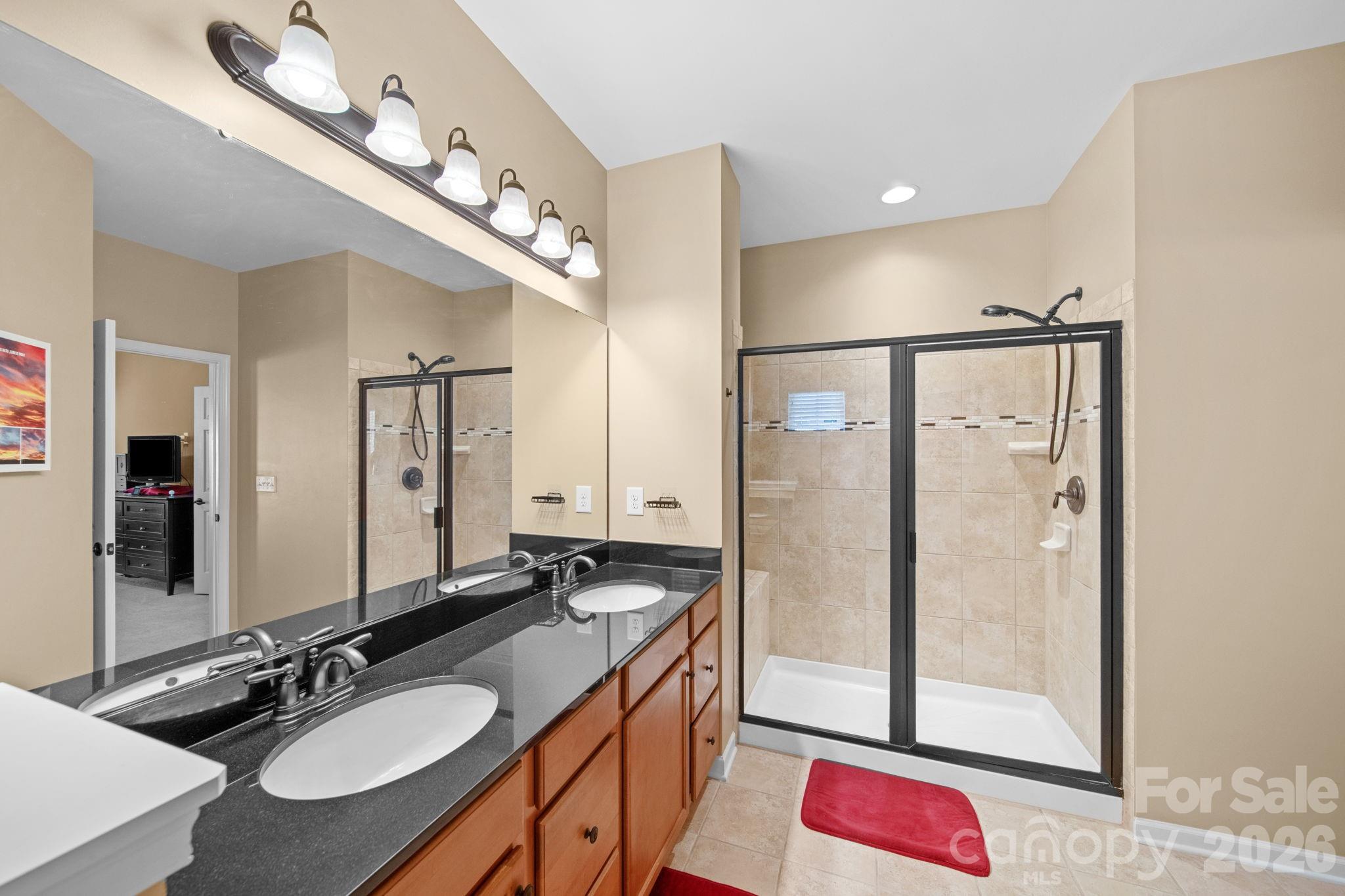 115 Inlet Point Drive Fort Mill, SC 29708 - Photo 36 of 48 a bathroom with a double vanity sink mirror and double