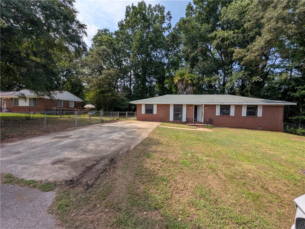 203 Glendale Road Anderson, SC 29624 - Photo 2 of 20 A classic brick exterior, green lawn, and shady trees define this welcoming residence.
