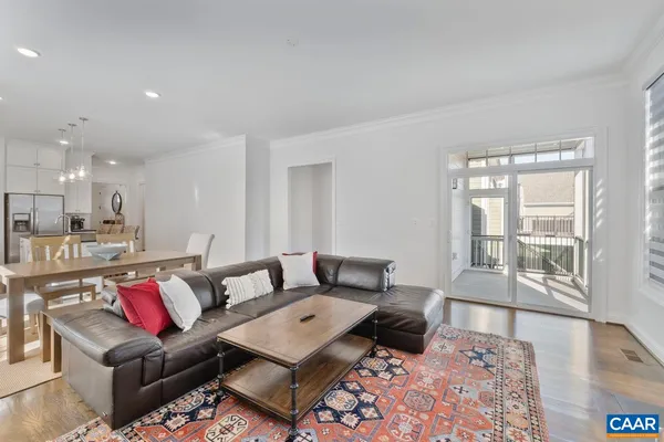 a living room with furniture and a table