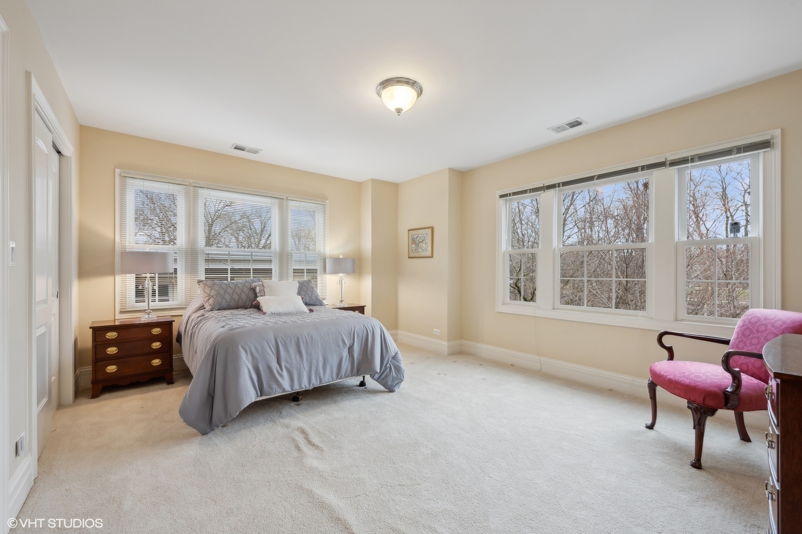 410 Green Bay Road Glencoe, IL 60022 - Photo 13 of 27 a spacious bedroom with a bed and a chair