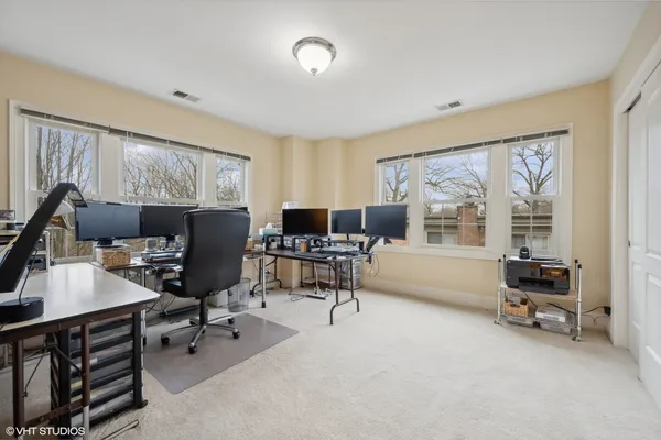 a workspace with furniture and a window