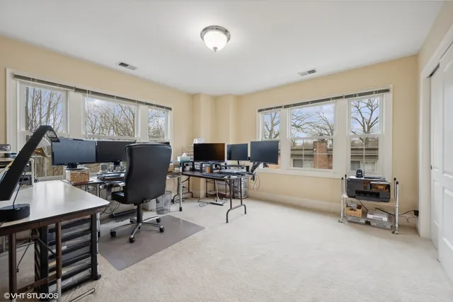 a workspace with furniture and a window