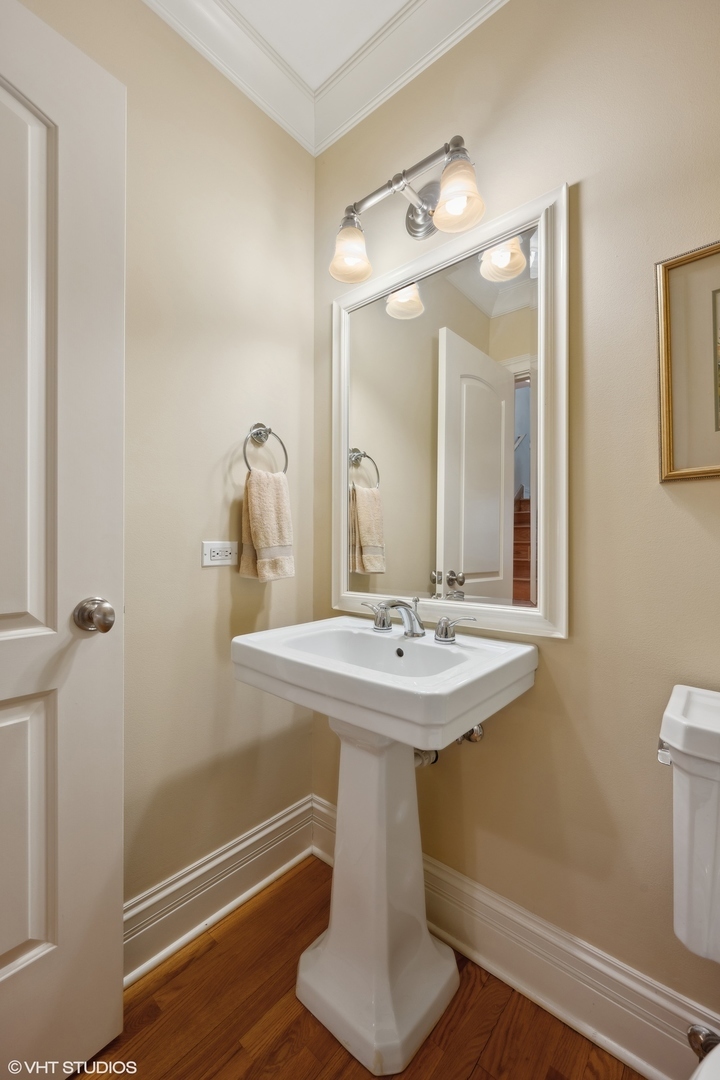 410 Green Bay Road Glencoe, IL 60022 - Photo 9 of 27 a bathroom with a sink a toilet and mirror