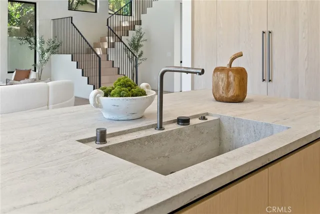 a bedroom with a large bed and a large window