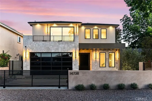 a living room with furniture kitchen and a table