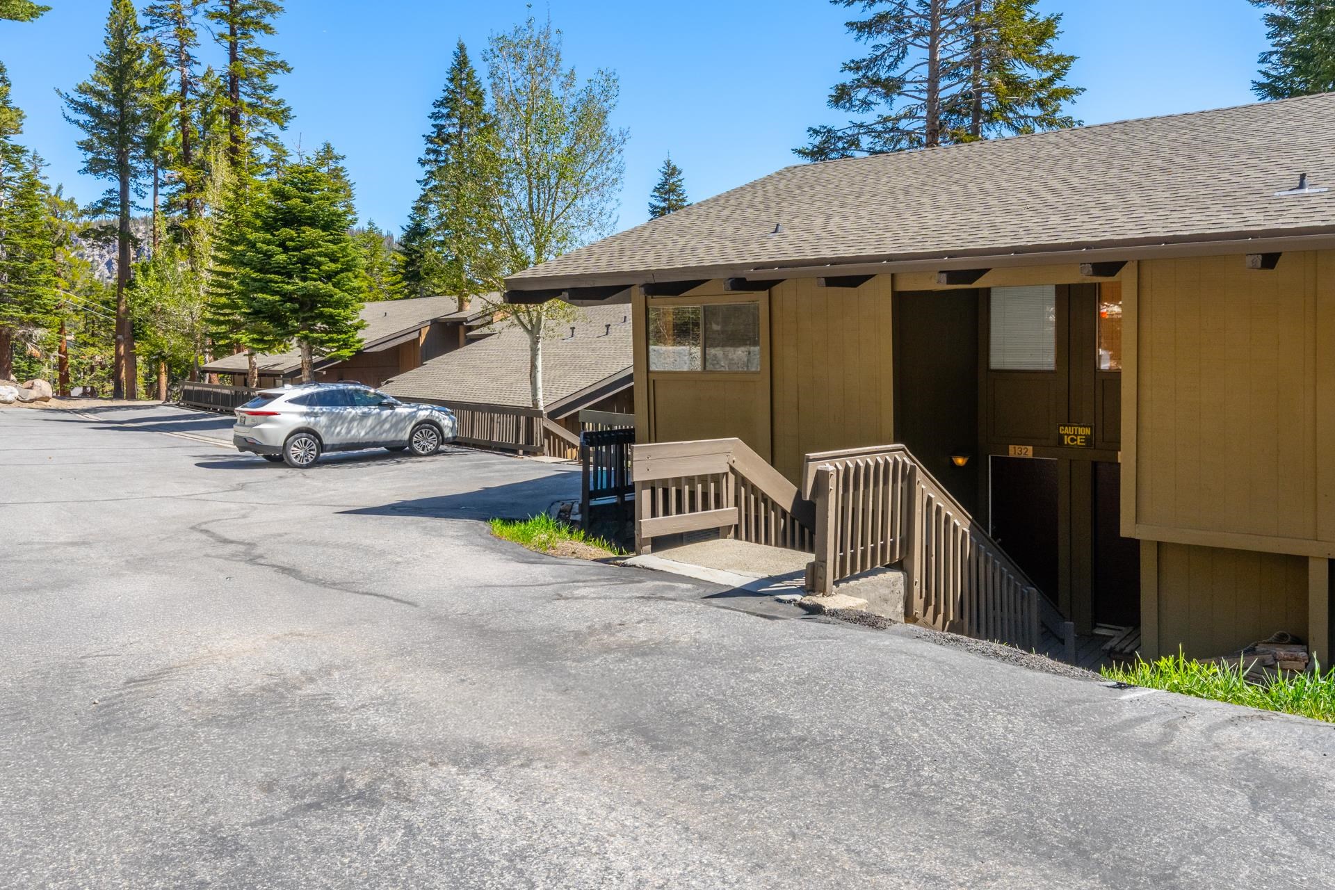 94 John Muir Road, Unit 132 Mammoth Lakes, CA 93546 - Photo 37 of 58 a view of a house with a patio and a yard
