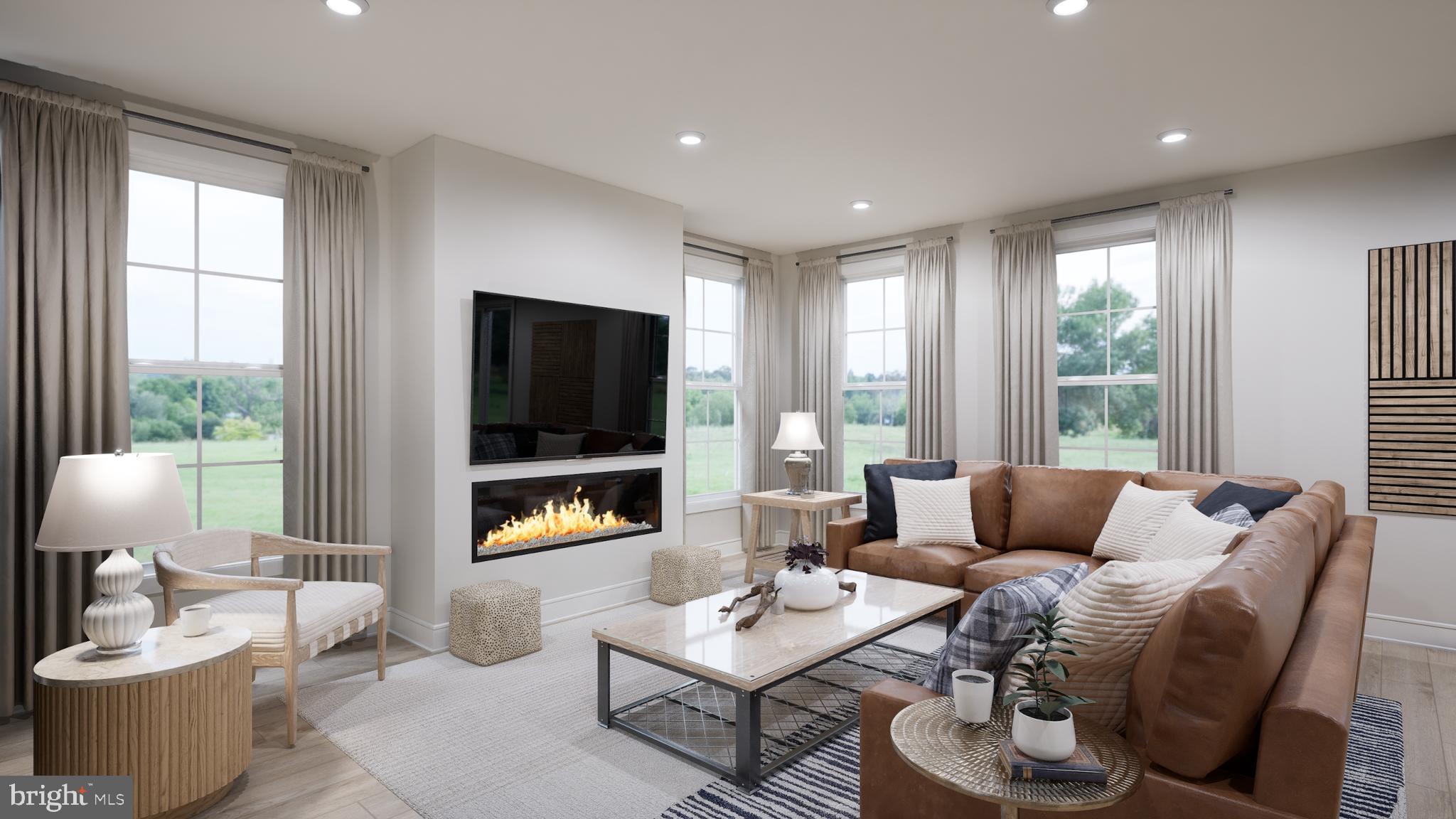 Snowden Bridge Boulevard Stephenson, VA 22656 - Photo 26 of 53 a living room with furniture and a flat screen tv