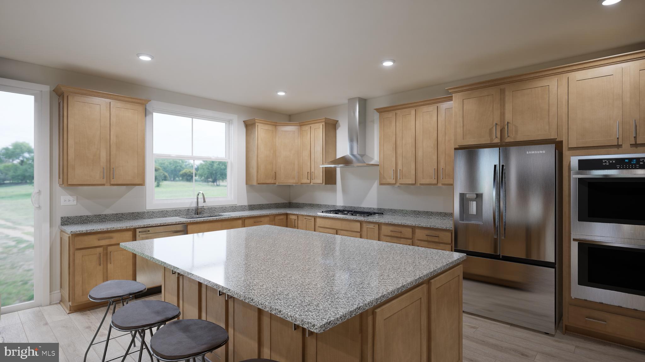 Snowden Bridge Boulevard Stephenson, VA 22656 - Photo 33 of 53 a kitchen with granite countertop kitchen island a table and a refrigerator