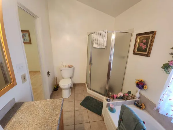 a bedroom with a bed and furniture