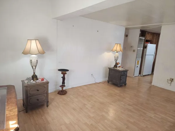 a view of a livingroom with furniture and a lamp