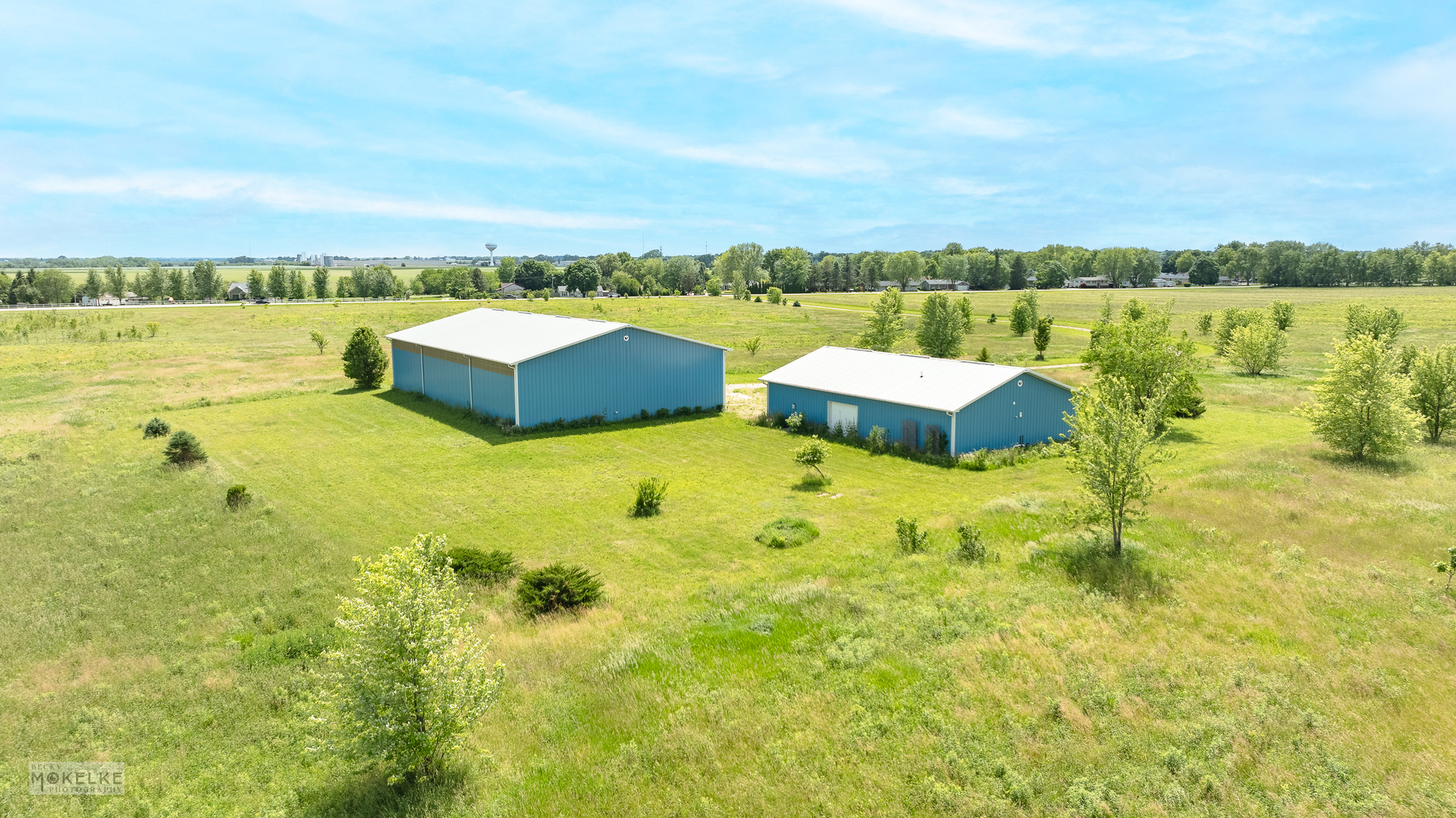 17551 Frazier Road Sandwich, IL 60548 - Photo 20 of 21 a view of a lake with couches in the background